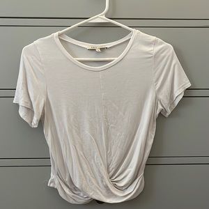 white shirt with a twist knot on the bottom